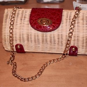 Wicker and red leather turn lock clutch
